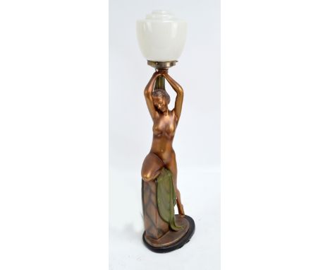 G.LEONARDI (LEONARDENE Co); an Art Deco gilt and painted ceramic figural lamp base modelled as a nude female leaning against 