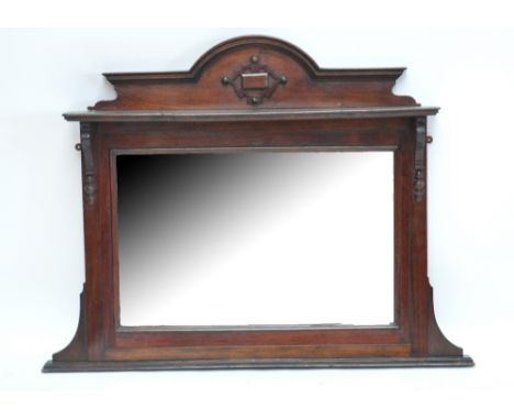 A mahogany framed overmantel mirror with bevelled rectangular plate and arched top above shelf, width 119cm.