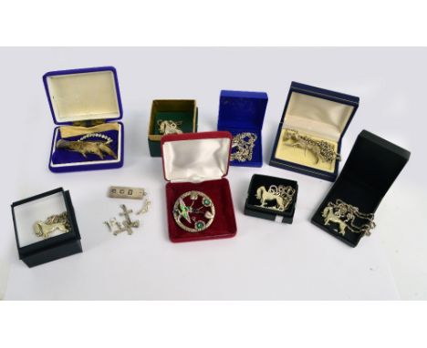 A quantity of silver jewellery including greyhound pendants, an ingot pendant, charms, crosses, an enamel and silver brooch, 