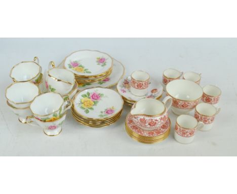 A Wedgwood 'Red Damask' pattern coffee set comprising six coffee cans and saucers, sugar bowl and a cream jug, a six setting 