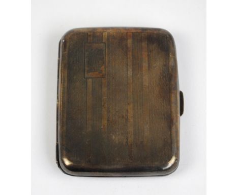 HARMAN BROS; a George V hallmarked silver rectangular cigarette case with overall engine turned decoration and rectangular ca