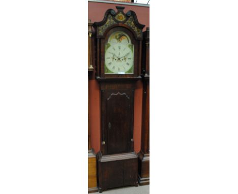 An early 19th century oak and mahogany crossbanded longcase clock, the broken swan neck pediment above arched repainted dial 