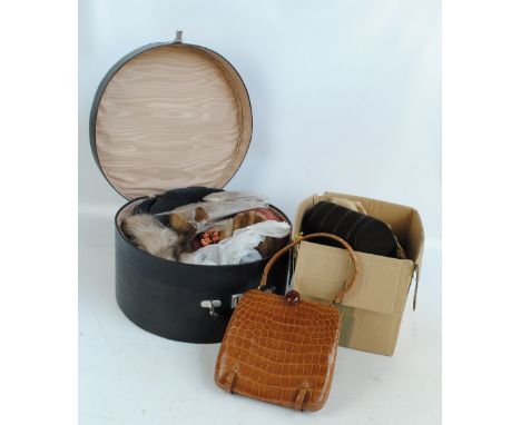 A small group of vintage hats including straw example, a group of fur items including gloves and scarf, contained in a Revela