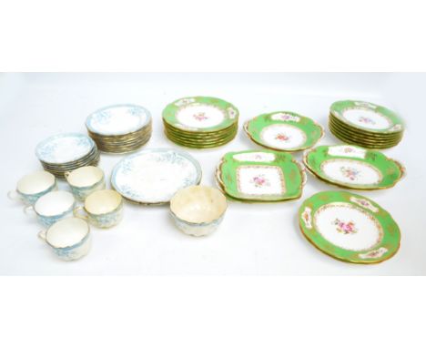 A Coalport dessert service comprising three pairs of differently shaped shallow bowls and sixteen plates, all decorated with 