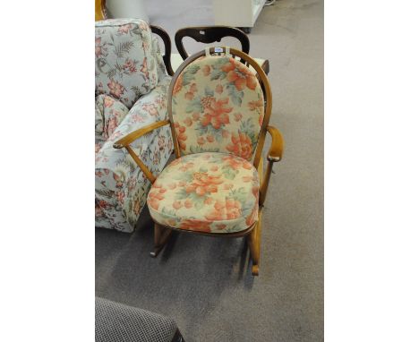 An Ercol rocking chair, with sticker no. 470, width 68cm.