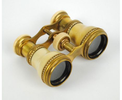 A pair of late 19th century ivory & vegetable ivory lacquered brass framed opera glasses, width 10.5cm.   CONDITION REPORT:  