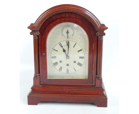 A mahogany cased bracket clock, the circular dial set with Roman numerals beneath chime/silent dial, eight day Gustav Becker 