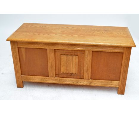An Agincourt light oak coffer with panelled linenfold front, top 106 x 45.5cm.