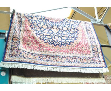 A blue ground Keshan carpet, 230 x 160cm.