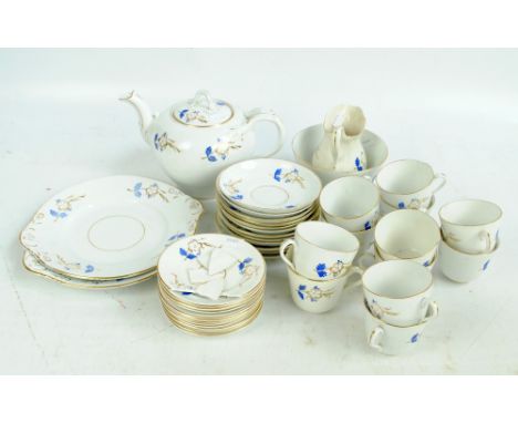 A late 19th century English blue and gilt heightened floral decorated part tea service.