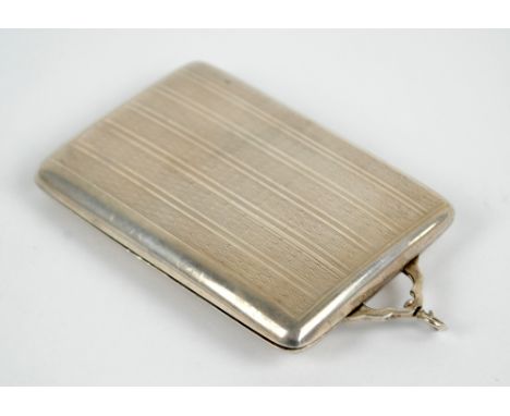 A George V hallmarked silver slide action cigarette case with overall engine turned decoration and suspension ring, maker's i
