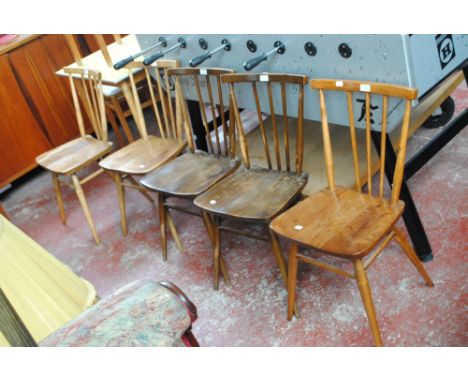 A set of five Ercol stick back chairs.