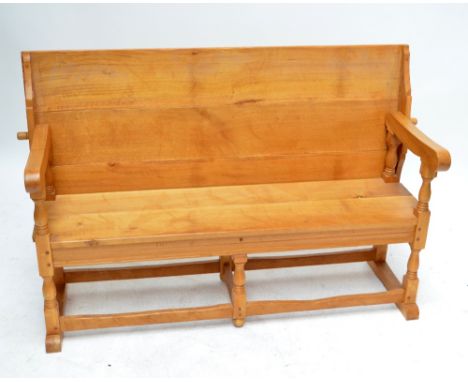 A large light oak monk's bench with sliding back, plank seat and turned and block supports, width 158cm.