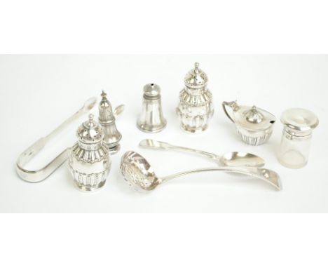 A pair of late Victorian hallmarked silver peppers, Birmingham 1895, a silver lidded salt, a silver peppers, a silver baluste