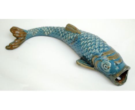 C.H. BRANNAM FOR BARUM; a late 19th century blue glazed wall pocket modelled as a fish, incised signature, dated 1898, length