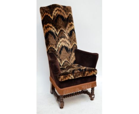 An early 20th century oak bobbin turned high back armchair.