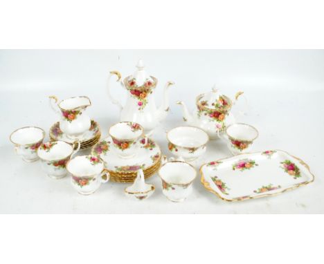 A Royal Albert 'Old Country Roses' pattern tea service comprising a teapot, coffee pot, cream jug, sugar bowl, six cups, five