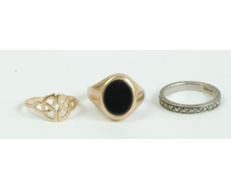 A 9ct yellow gold signet ring set with an oval dark hard stone, size Q, a 9ct Welsh gold Celtic knot ring, size M1/2, combine