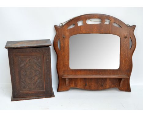 A small carved hanging cabinet, height 34.5cm, and a hall wall mirror with shelf and hooks, 50 x 54cm (2).