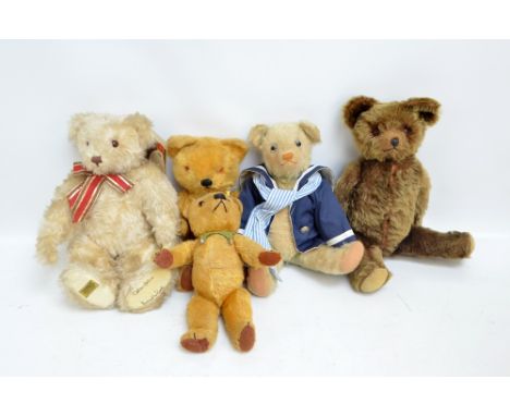 Five teddy bears comprising a limited edition Merrythought mohair 'Ivory Bear IV201' with glass orange and black eyes, stitch