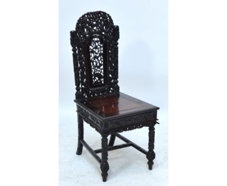 A 19th century Chinese carved rosewood (probably huanghuali) side chair, the well detailed pierced back decorated with dragon