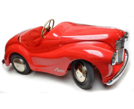 A 1950s Austin pedal car, painstakingly restored with correct parts, triple chrome plating in Sheffield, length 17cm, width 7