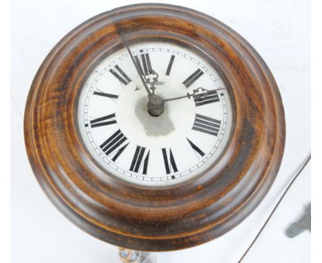 An early 20th century mahogany circular chain driven wall mounted alarm clock, the circular dial set with Roman numerals, dia