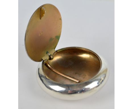 ROBERT CHANDLER; an Edward VII hallmarked silver squeeze action snuff box of plain circular form with flash hinge to the lid 