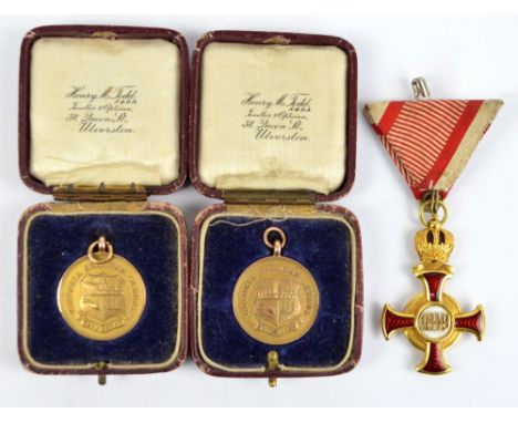 A pair of cased circular 9ct gold Ulverston Grammar Academic medals on suspension rings with presentation inscriptions to rev