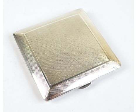A George VI hallmarked silver square section cigarette case with overall engine turned decoration, maker's initials R.N, Birm
