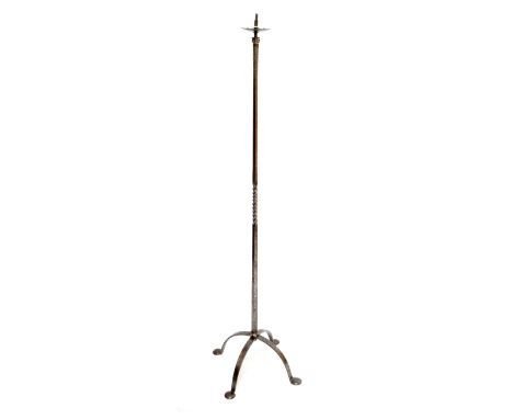 An Arts and Crafts polished steel standard lamp with square section and part wrythen twisted column to four outswept supports