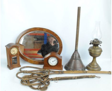 A mixed collectors' lot, comprising two carpet beaters and Eclipse posser, a glass oil lamp with circular base, two mantel cl