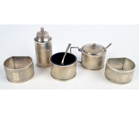 DAVID SUTTON & SONS; a George VI hallmarked silver three piece engine turned linear decorated cruet set comprising a circular