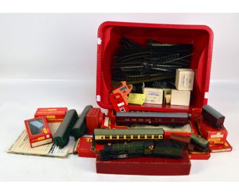 A quantity of Tri-ang Hornby locos, wagons and track, to include a 'British Railways Denbigh Castle 7032' loco and coal wagon