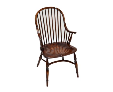 ANDREW KIDD; a reproduction elm seated hoop stick back elbow chair with turned front legs and crinoline stretcher.