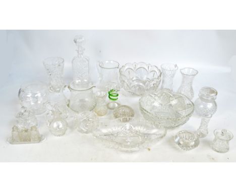 A quantity of clear cut and pressed glass to include a decanter, a miniature cruet set, various vases, etc. 