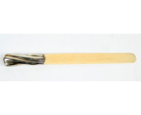 An early 29th century ivory bladed silver handled page turner, marks obscured, (af) length 36cm.