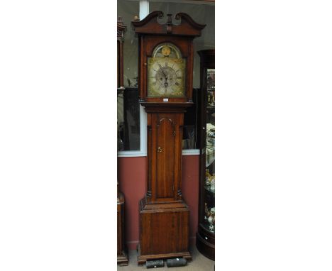 An oak longcase clock, the broken swan neck pediment above arched dial inscribed above the rolling moon phase 'Richd. Jackson