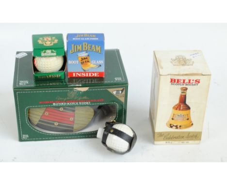 A boxed McGibbon's Special Reserve Golf Club flagon, a small Bell's Celebration Scotch Whisky, two golf balls of whisky and a