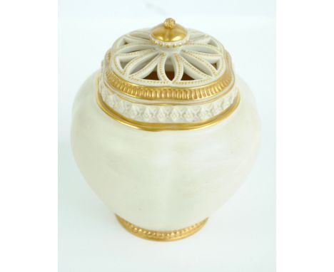 A Royal Worcester blush ivory potpourri pot and cover of rounded rectangular form, the gilt heightened pierced cover above pl