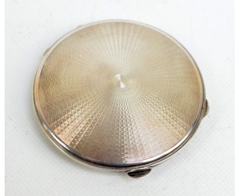 DAVID SUTTON & SONS; a George VI hallmarked silver circular overall engine turned decorated powder compact with mirror, Londo