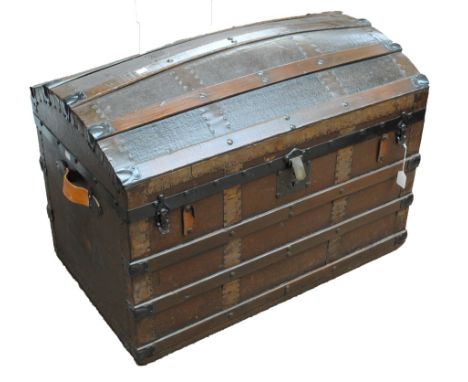 A dome top steamer/travelling trunk with leather carrying handles, monogrammed 'E.A' to both sides, height 63cm, width 87cm, 