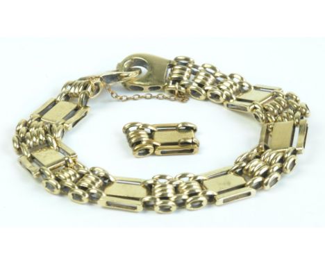A 9ct yellow gold bracelet with fancy gate and panel links. length 15.5cm, supplied with extra link, combined approx 17.2g.