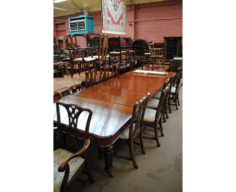 A good early Victorian mahogany extending dining table, the rounded rectangular top with three broad leaves raised on lobed t