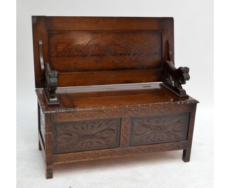 A c.1900 carved oak box seat monk's bench, width 106cm.