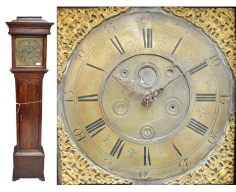 JNO MILNER OF BURNLEY; an oak cased thirty hour longcase clock with caddy top above cast and pierced decorated square face wi