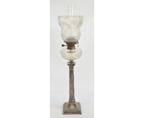 A late 19th century silver plated Corinthian column oil lamp with swagged stepped square base with cut glass reservoir and et