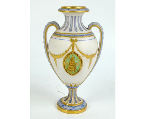 A mid-19th century Parian blue tinted and gold heightened twin handled vase decorated with a lancet shaped panel for Richmond