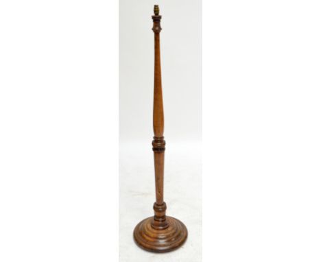 A walnut standard lamp.