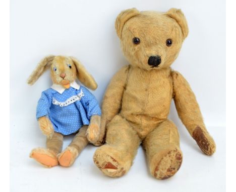 A Steiff button-in-ear rabbit with blonde fur, length 45cm, with button in ear and an early 20th century straw-filled teddy b